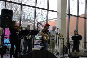 ChickenFat performing on stage in the cafeteria