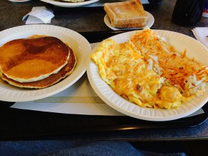 Pancakes with Toast, a Chicken and Cheese Omelet and Hash Browns