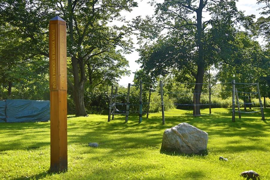 In six different languages, the peace pole reads “May peace prevail on earth.” On the right is a 1.8 billion year old crystal.