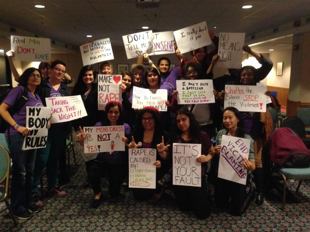 Members of Feminist Collective and event attendees gathered at “Take Back The Night” event at NEIU.