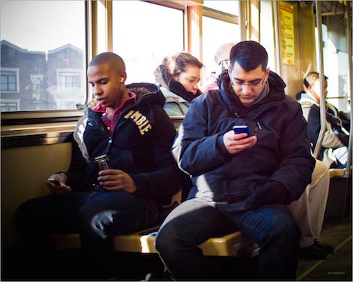 People texting on the El.