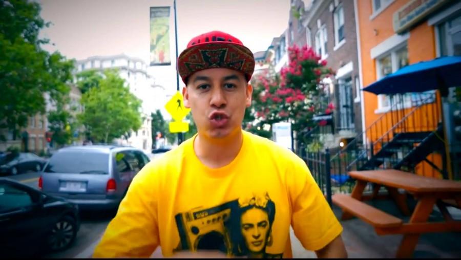 Olmeca rocking a Friday Kahlo tee in his music video for Browning of America.