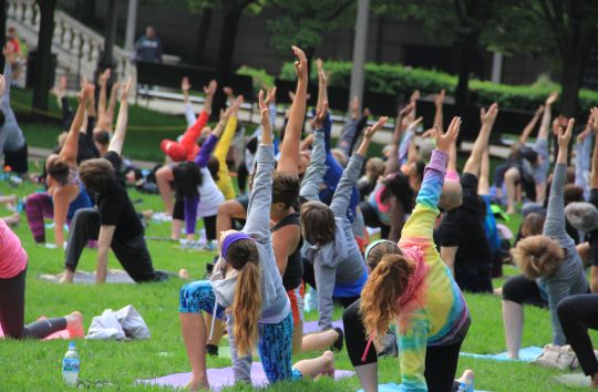 A crowd gathers for Saturday morning yoga on June 13, at Millennium Park. Free summer workouts take place through early Sept. 