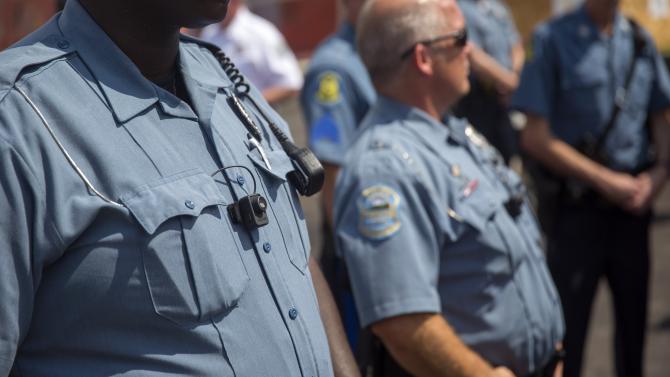Police officers wear body cameras as part of their uniform per request of their department. 
