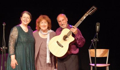 Kathy Cowan [left] and Joseph Sobel [right] stand with their producer Liz Weir [center] at the Little Theatre in Cushendell.