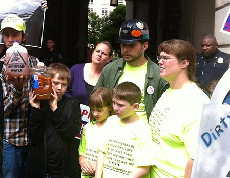 A group of anti-mountaintop removal activists gather outside of the Environmental Protection Agency Headquarters in May 2013 to protest the poisoning of their waterways./Photo by Mary Kroeck