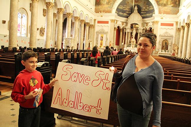 Silvia+Villanueva+and+her+son%2C+Osvaldo%2C+joined+dozens+of+members+of+St.+Adalberts+in+a+prayer+vigil+and+march+in+Pilsen+on+April+15+to+protest+the+churchs+closing.%2FPhoto+by+Mary+Kroeck