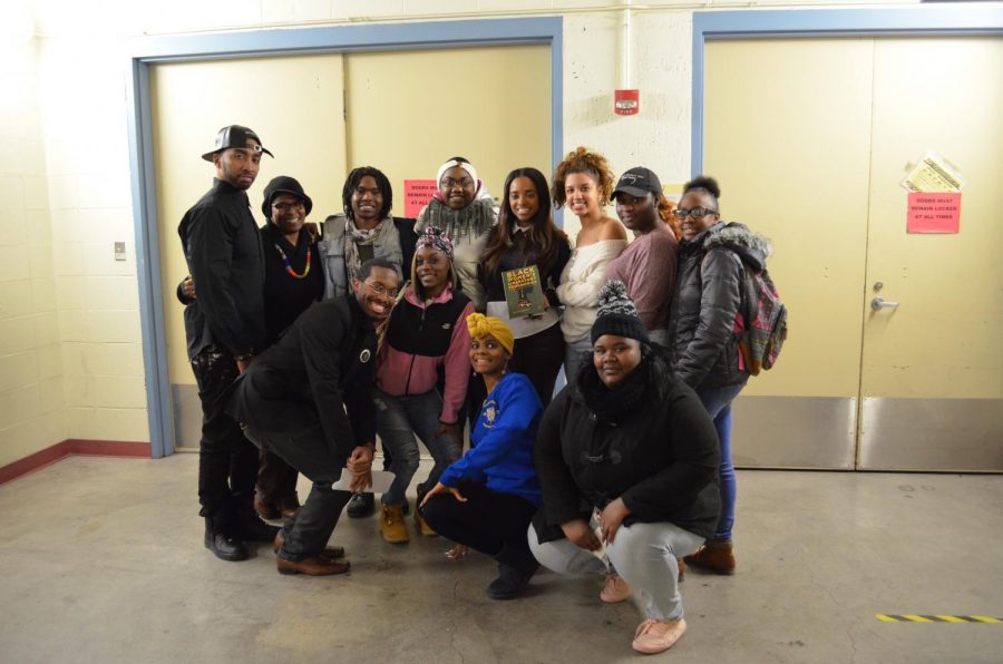 “Tamika D. Mallory, SGA President Ashlei Ross, Master of Ceremony Alexx Brown and artist Mysonne pose with students after the event.”