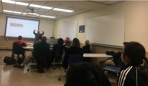 Barry Dayton demonstrating a math modeling technique at the open house.  