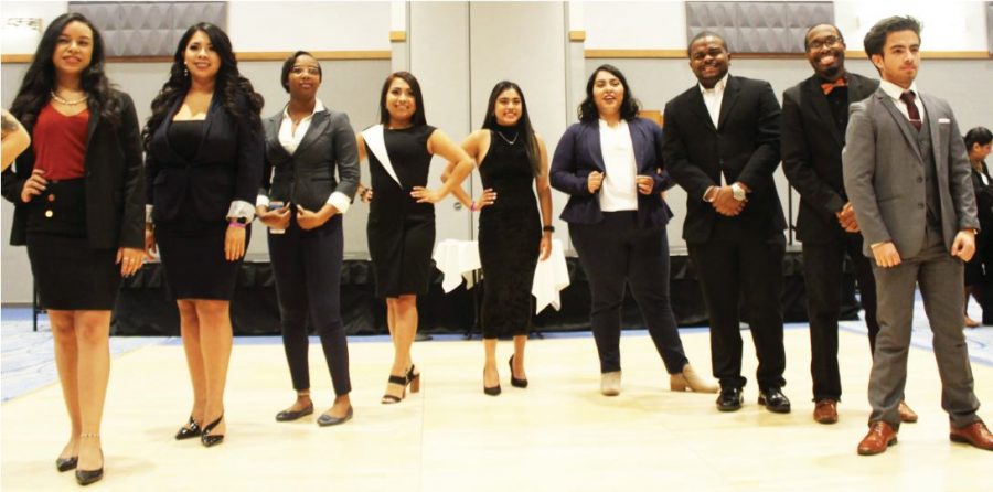 Drew Andrade (center), coordinator of the NEIU Power Closet, with some of the students who volunteered as models for the business attire fashion show. | Photo by Tim LeCour