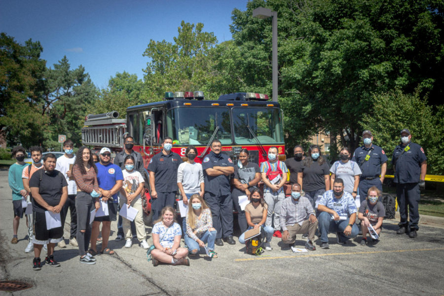 The Operations Management class line up with Engine Company #89 in front of the engine.