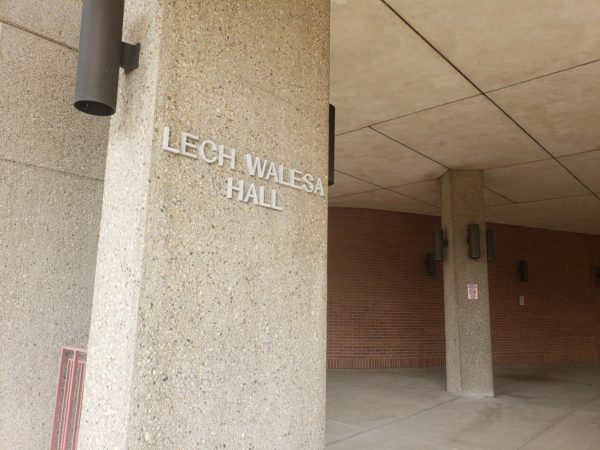 Outside sign of Lech Walesa Hall, in column on the side of the North Side campus building 