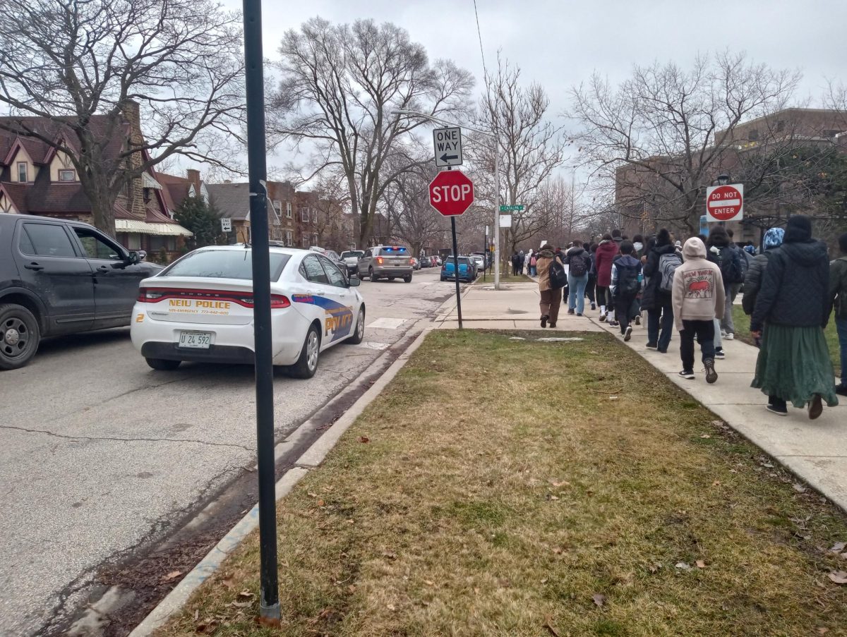 NEIU+police+and+an+undercover+police+car+monitoring+students+during+the+walk