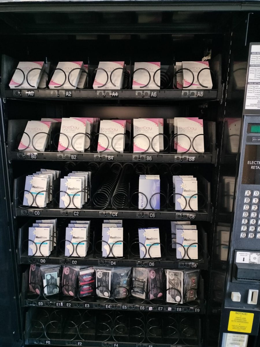 Vending machine stocked with Plan B, Maxi Pads, and condoms
