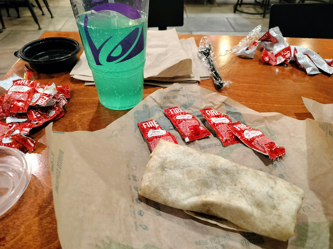 
Taco Bell customer’s meal order before indulging in a burrito and Baja Blast soda during meal time at Taco Bell on Devon Ave., the closest to NEIUs main campus, in Chicago on Wednesday, February 28th, 2024, as the customer savors every bite for the purposes of achieving satiety.