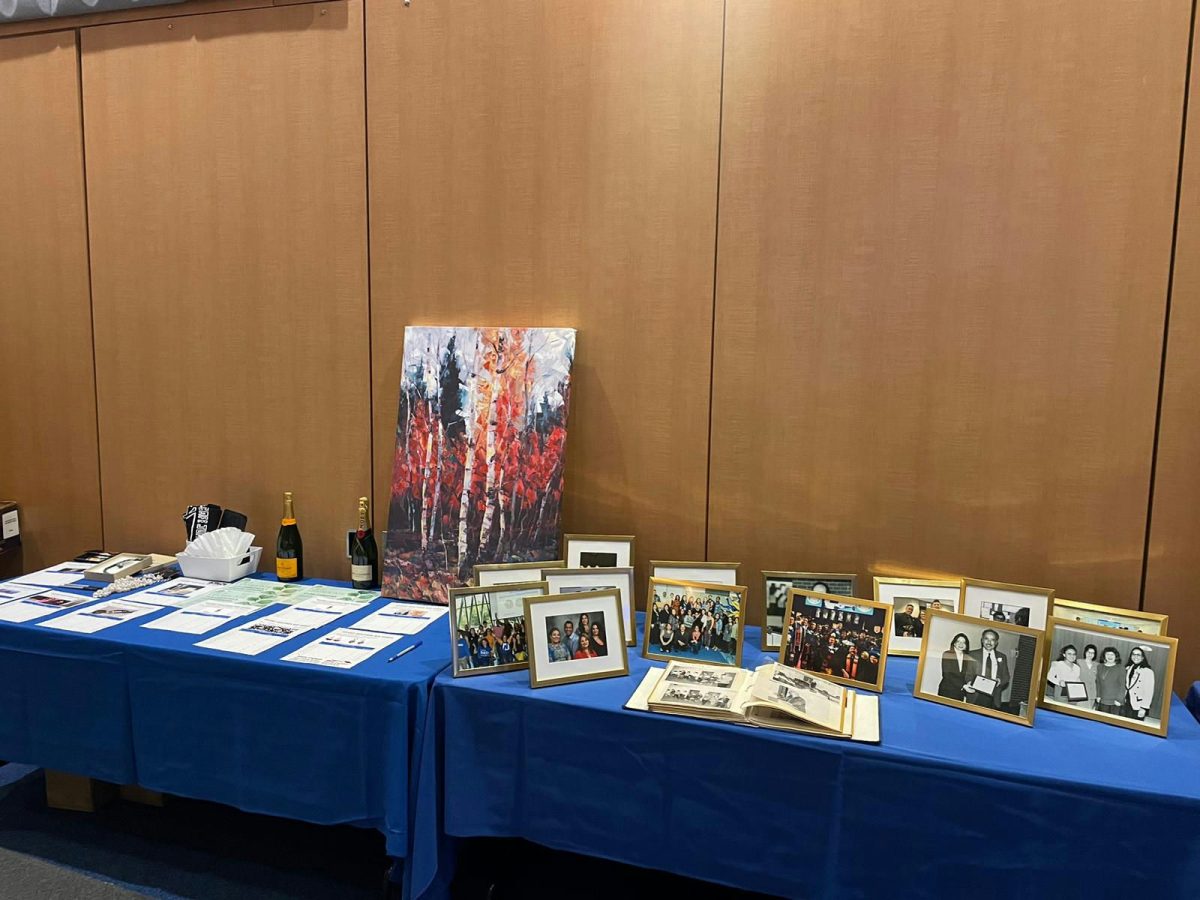 The photos (right) in various picture frames sitting on a blue table cloth depicted the history of Proyecto Pa'lante from its beginnings in 1972. 