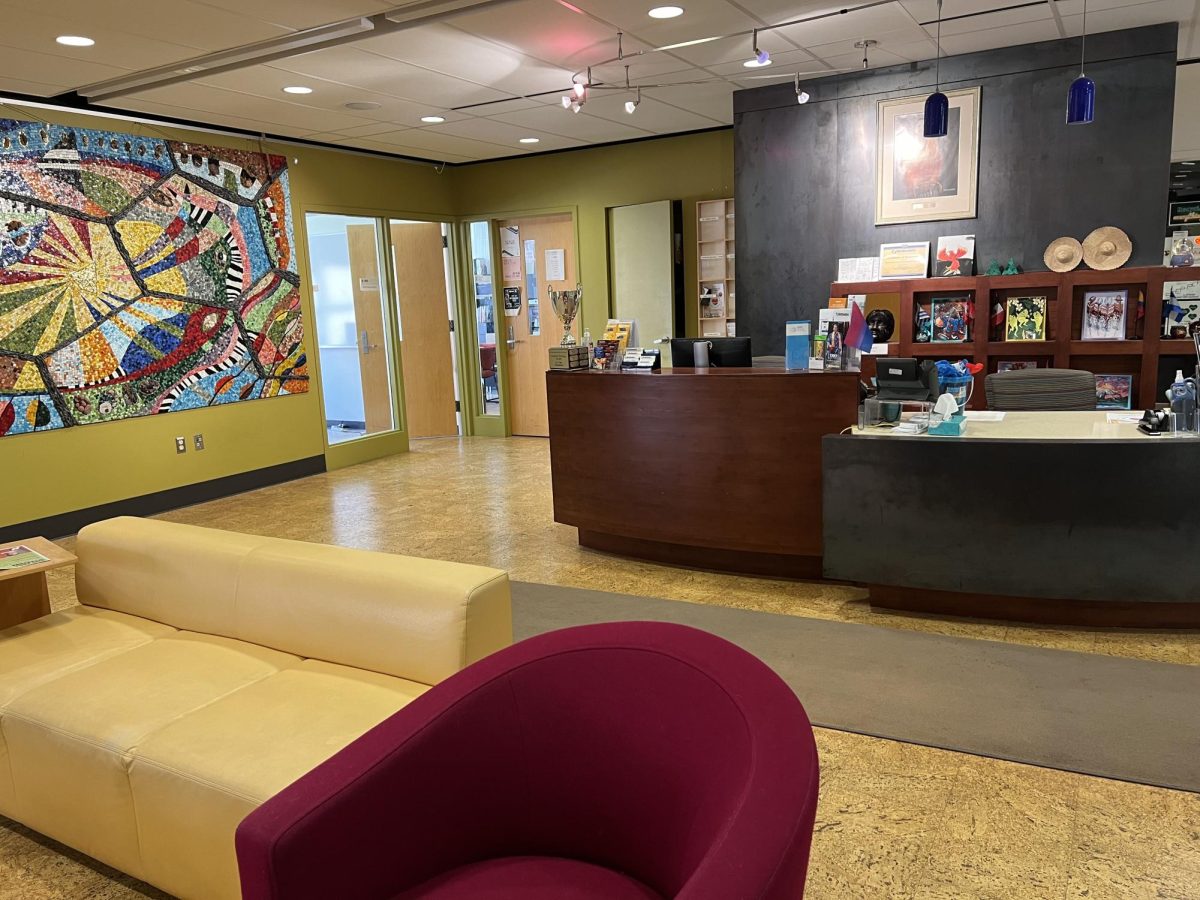 The reception of Pedroso Center is on the right side when you enter the Pedroso Center with two helping desks black and brown.