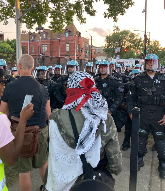  several Chicago Police dressed in heavy black riot gear