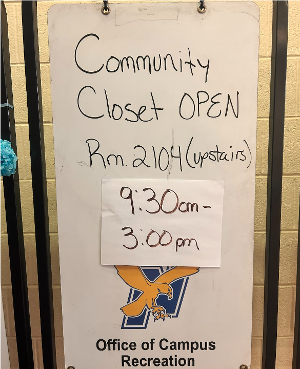 A sign in the P.E. Complex with Community Closet hours