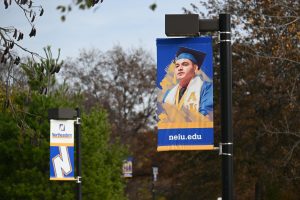 NEIU promotional banners that line the sidewalk between WTTW and The Nest.