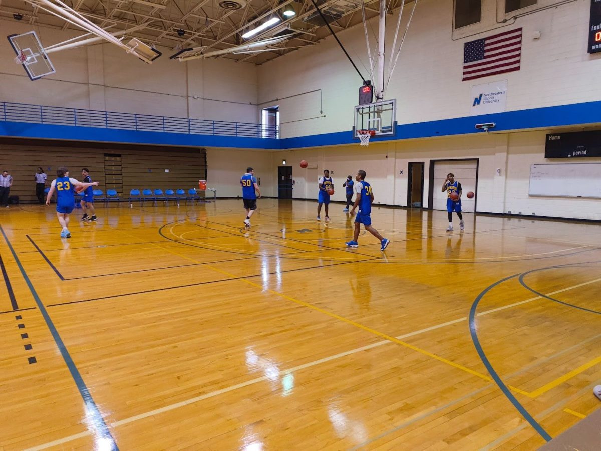 NEIU’s Golden Eagles men’s basketball team gets some pre-game practice as they warm up for a competitive match.