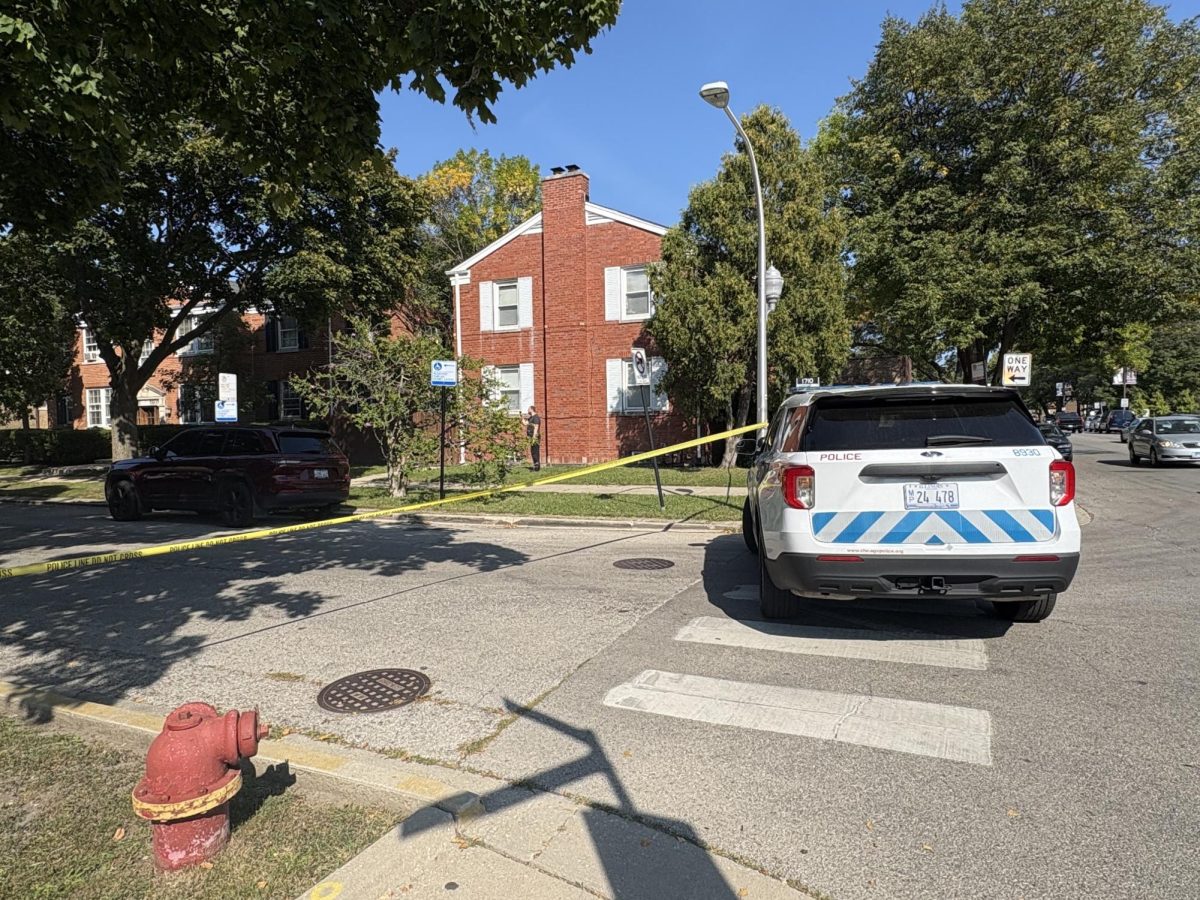 A CPD police car on Bryn Mawr and Drake, blocking off traffic into the street, along with the yellow tape. 